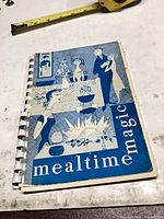 Front cover showing title, illustration and plastic comb binding