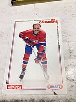 Front view of glossy promotional card showing Mike McPhee image and logos