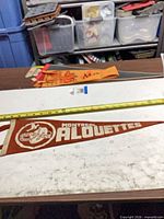 Full pennant on table with tape measure showing length