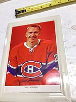 Front view showing colour photo, player, frame and tape measure for scale