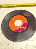 Side A label showing title Give Us One More Chance on Much Records