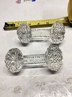 Pair of clear cut crystal knife rests side by side
