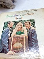 Front sleeve of Peter, Paul and Mary Moving LP showing wear and writing