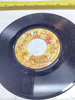 A-side label showing title, artist and condition of grooves