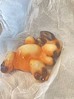 Top view of glazed ceramic bunny figurine showing color and pose