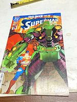 Front cover of Superman #32 showing artwork and DC logo
