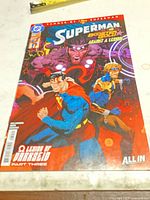 Front cover of Superman comic showing title, characters, storyline subtitle and DC logo