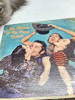 Front sleeve of Deliver LP showing artwork and wear