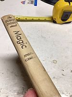 Spine showing title, author and cloth material