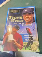 Front cover showing title, Tiger Woods image, Grand Slam Edition banner