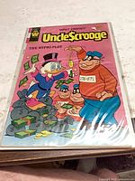 Front cover of Uncle Scrooge comic in bag and board