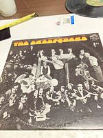 Front of album jacket showing title "The Grandfakake" and collage artwork