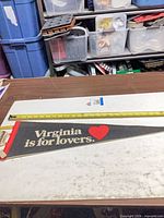 Full pennant with measuring tape showing length