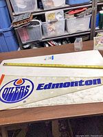 Full view of pennant with tape measure showing length