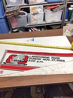 Full view of vinyl pennant with measuring tape for scale