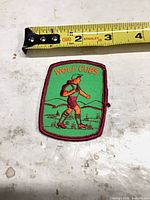 Front of Wolf Cubs patch under tape measure