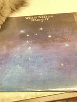 Front album cover with starry artwork and title