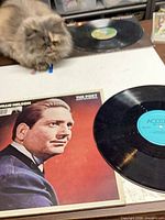 Front view of sleeve and record on table