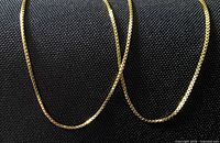 Close-up showing box-link pattern and gold tone