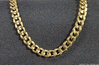Close view of Cuban-link pattern on bracelet