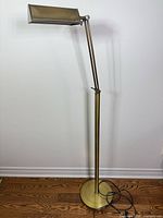 Full view of brass floor lamp with rectangular task head
