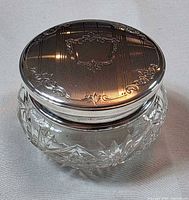Full view of jar showing cut crystal body and sterling lid