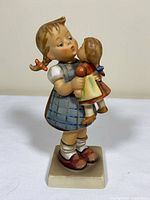 Front view of Hummel Goebel "Kiss Me" figurine