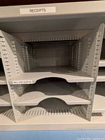 close view of left section with labeled dividers and removable shelves