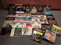 All records laid out face-up showing front covers