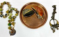 Tray centered with two pendants on tray, necklace in image but not part of lot