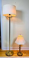 Both lamps side by side lit to show size difference and working condition