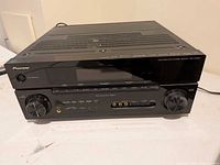 Front and top view of Pioneer AV receiver showing model and general condition