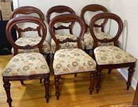 Front view of all six chairs showing style and upholstery