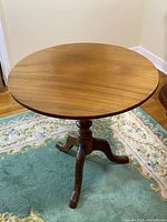 full view of table assembled showing pedestal and tripod legs