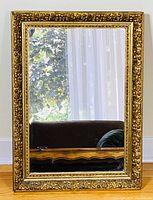 full front view of rectangular gilded wall mirror