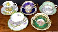 All five teacup and saucer sets displayed
