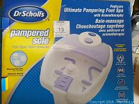 Top view of the product box showing the brand, product name, and features including four aqua jets, smart heat, bubbles, and massage.