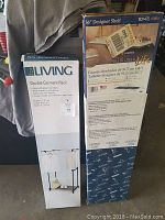 Two boxed items: a Double Garment Rack box and a 36 inch Designer Shelf box placed side by side.