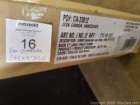 Photo of shipping box label showing product information including model name 'Danny Bookcase Low Wide', color dark brown, and dimensions.