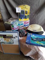 Image showing all items in the lot including the Quartet board, Revell model kit, audio devices, Really Useful Boxes, and audio media.