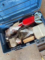 Open Mastercraft toolbox showing fittings, tail light lens and parts