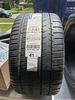 Front view of one Michelin Pilot Super Sport tire showing tread pattern and factory label