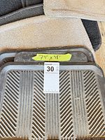 Stack showing carpet and rubber mats with dimension label