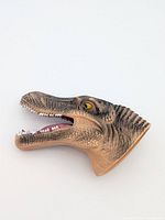 Left side view of dinosaur head puppet