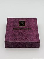 Purple patterned box top labeled "Products by Isabella Graduation Photo Album 6" x 4"