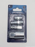 Front of sealed Mastercraft 4-piece 1/4" IM connector kit showing all four fittings in packaging