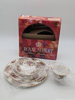 Box with plates and cup wrapped