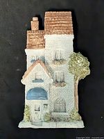 Front view of cast stone townhouse wall plaque showing details