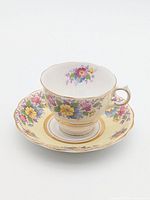 Teacup on saucer showing pattern and colours
