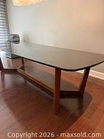 Full view of table showing stone top and cedar base